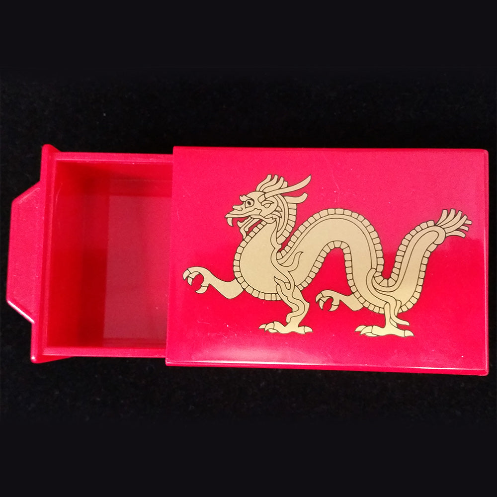 4.5" x 3" x 1.5" plastic red box with a dragon design on the front. An outer drawer slides out when the back is intact. An inner drawer slides out when the back is shifted out.