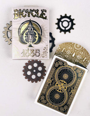 1885-themed Bicycle playing cards have a black and gold design on the back resembling mechanical gears.