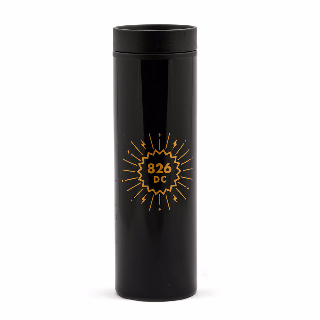 Tall, black plastic travel mug with 826DC logo in gold.