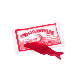 Thin, plastic, transparent red fish that predicts your fortune based on how it folds in your palm.