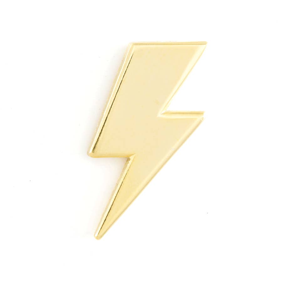 2 inch metallic gold pin in a lightening bolt shape. 1 inch rubber enclosure on the back.